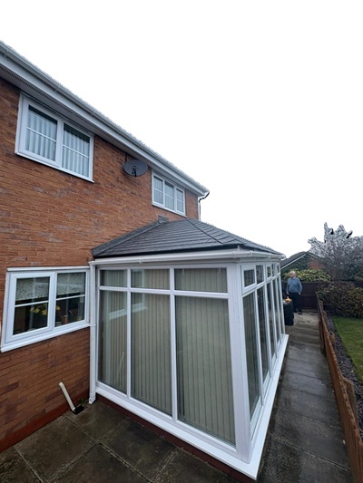 Tiled conservatory roof replacement exterior — Stockport area showing finished install