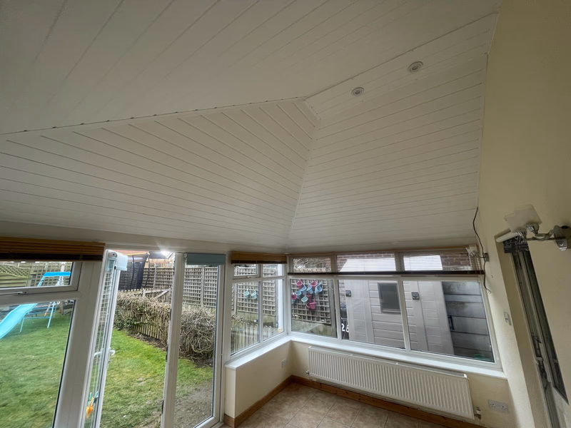 Bright conservatory interior after tiled roof conversion